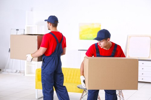 Moving van and boxed household items prepared for a removal service