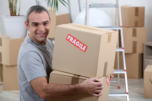 Professional packers organizing household items in Pimlico
