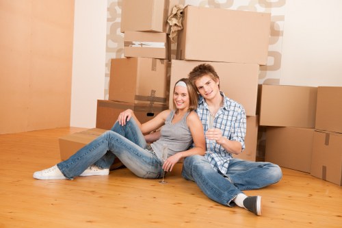 Professional movers loading furniture into a van in Pimlico