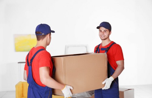 Students packing boxes for removals in Pimlico