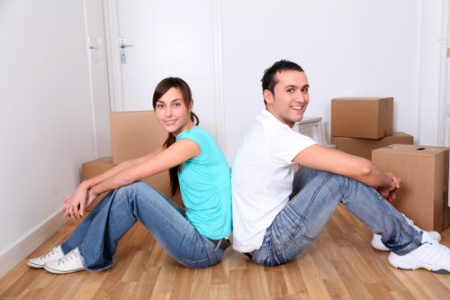 Packed boxes and protected furniture ready for a home move in Pimlico