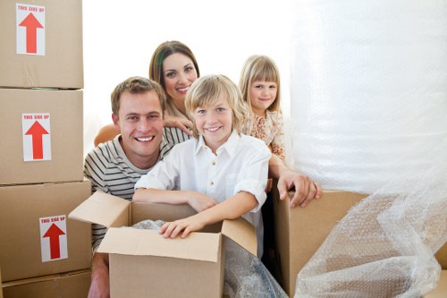 Trained movers handling boxes with care during a Pimlico relocation