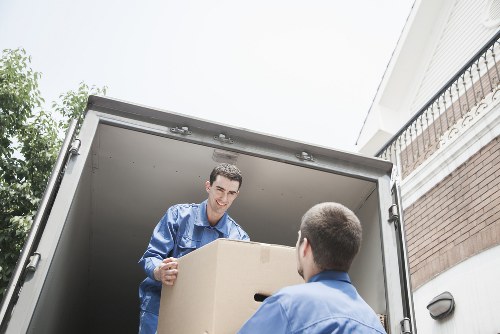 Loading furniture into a removal truck in Pimlico
